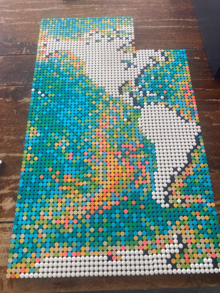 Lego world map partially completed. It shows a pixelated view of the Americas so far.