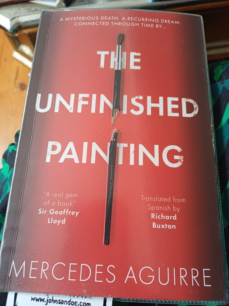A red book cover with the title The Unfinishrd painting in bold white and the author Mercedes Aguirre in finer script in yellow below it