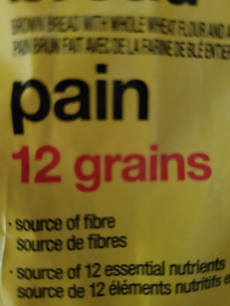 Close-up photo of yellow food packaging that reads, "pain - 12 grains."