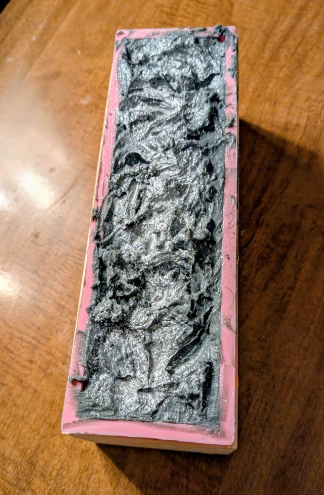 Loaf of soap with textured top, dusted with silver mica