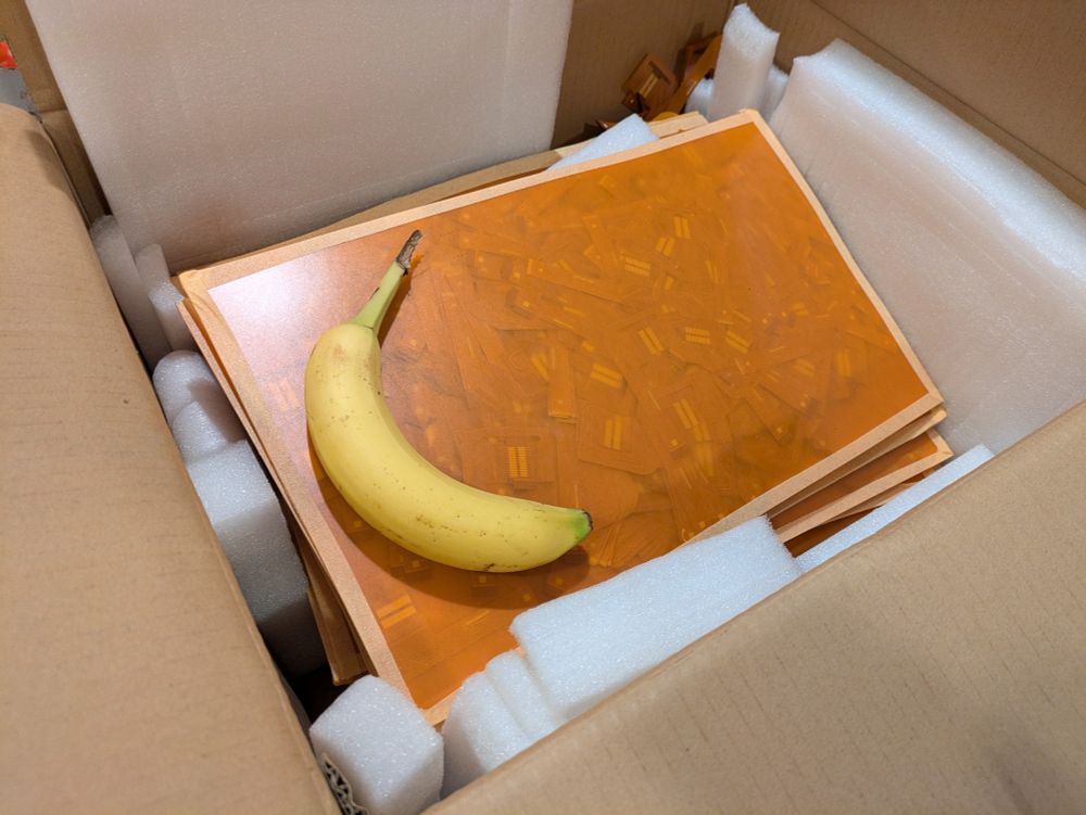 18000 flex PCBs in box, banana for scale
