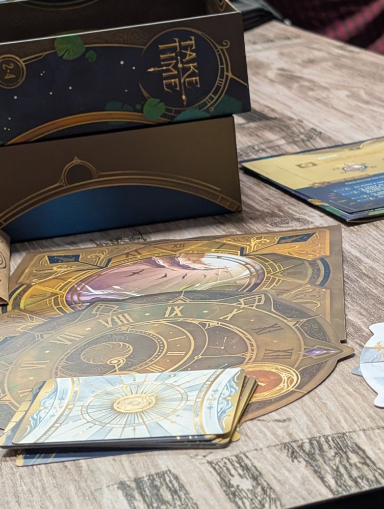 Photo du matériel et de la boîte du jeu de société Take time 