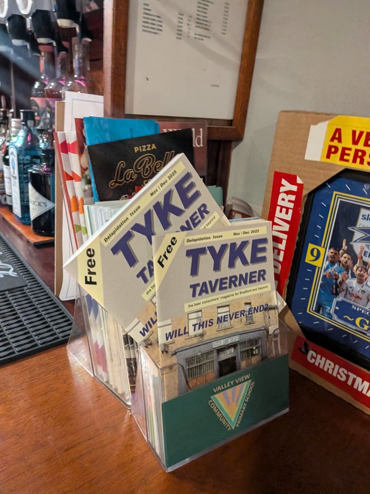 An A5 magazine titled Tyke Taverner stocked on a bar