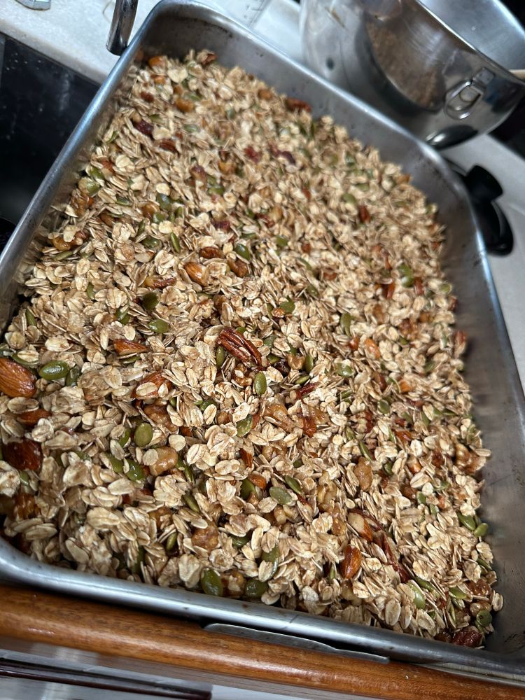 A pan of rolled oats studded with nuts and seeds, tossed to shiny with cinnamon, vanilla, and maple syrup, awaits a turn in the oven. It’s granola in the raw. Making this when we haven’t been near a store since January 26 means we’ve been self sufficient, and that makes me happy. 