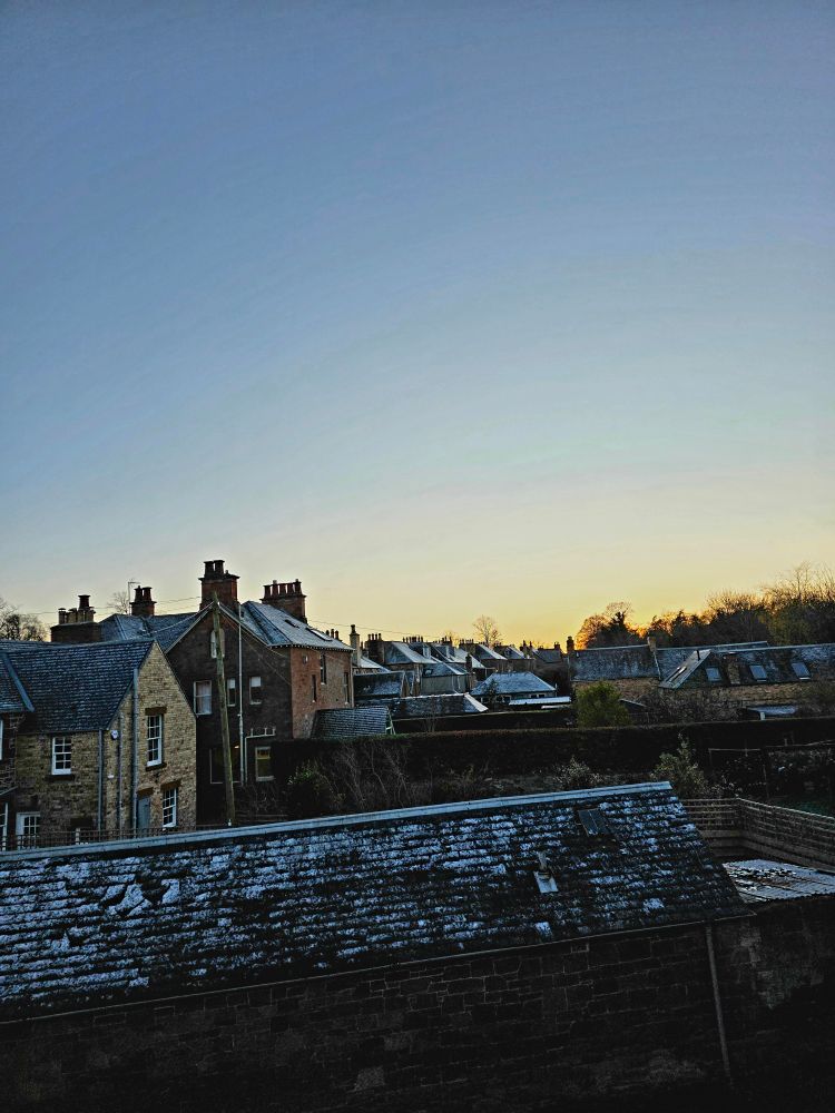 The sun setting through my living room window. 