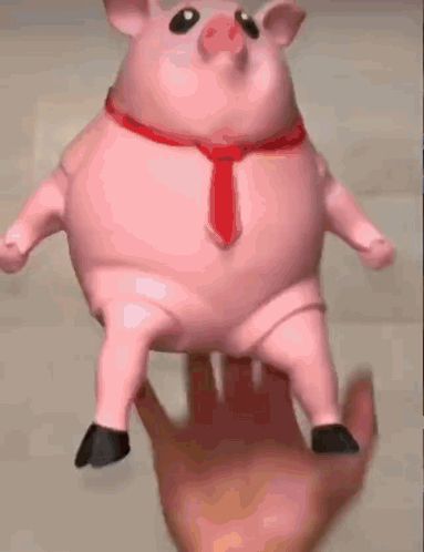 a pink pig with black socks on its legs