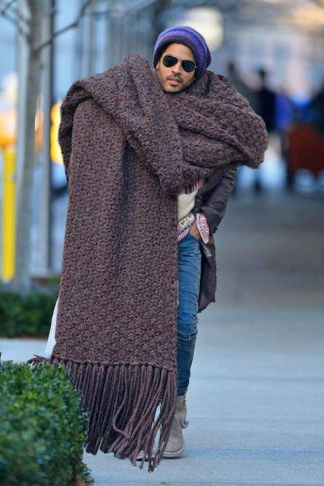Lenny Kravitz wearing an even bigger, some might say comically huge scarf
