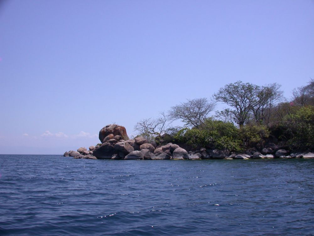 A scenic image of rocky shoreline of Lake Malawi, near Cape Maclear