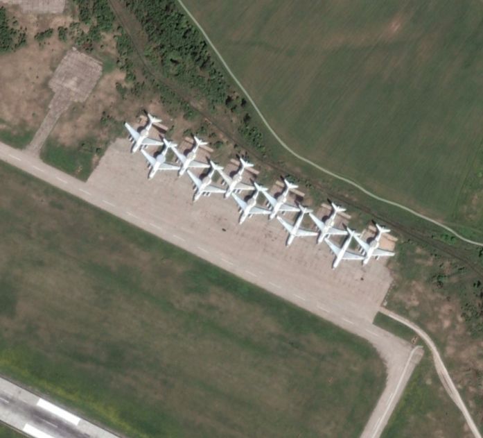 Screenshot from Google Earth, history layer, dated 082015. 9 A-50 
 and two Il-76 (or possibly A-50s with their radomes removed) aircraft on a hardstand. The two in the upper left corner are in the same place as the two A-50s visible in the SBU video. 