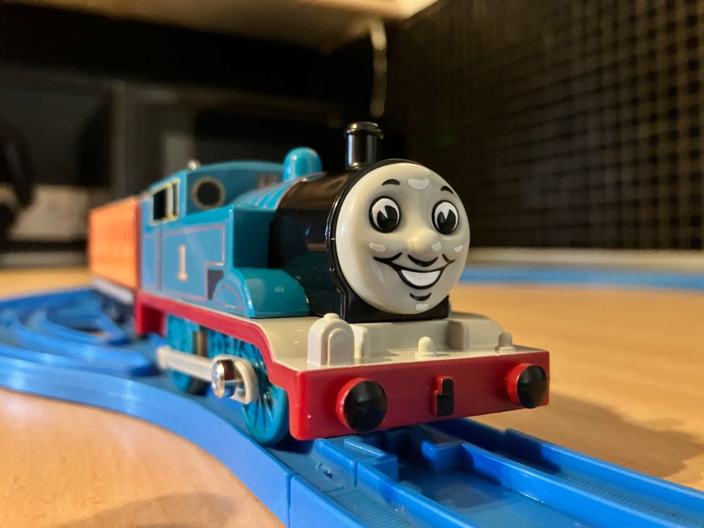 A low-angle view of the Plarail 80th Anniversary Thomas with his beautiful face on display