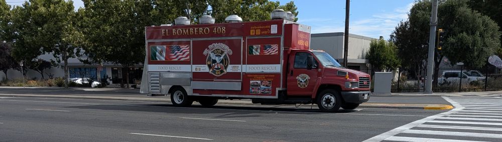 Food truck that is stylized as a fire engine.