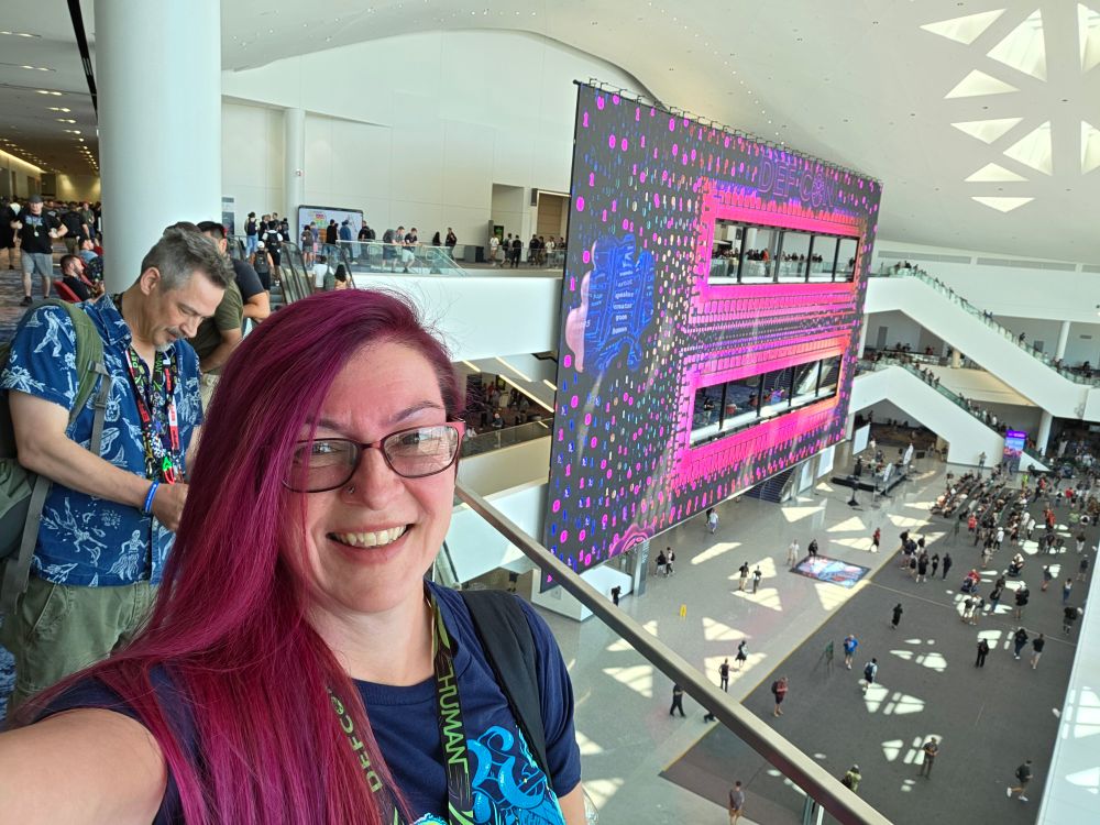 Me in front of Defcon ad board

