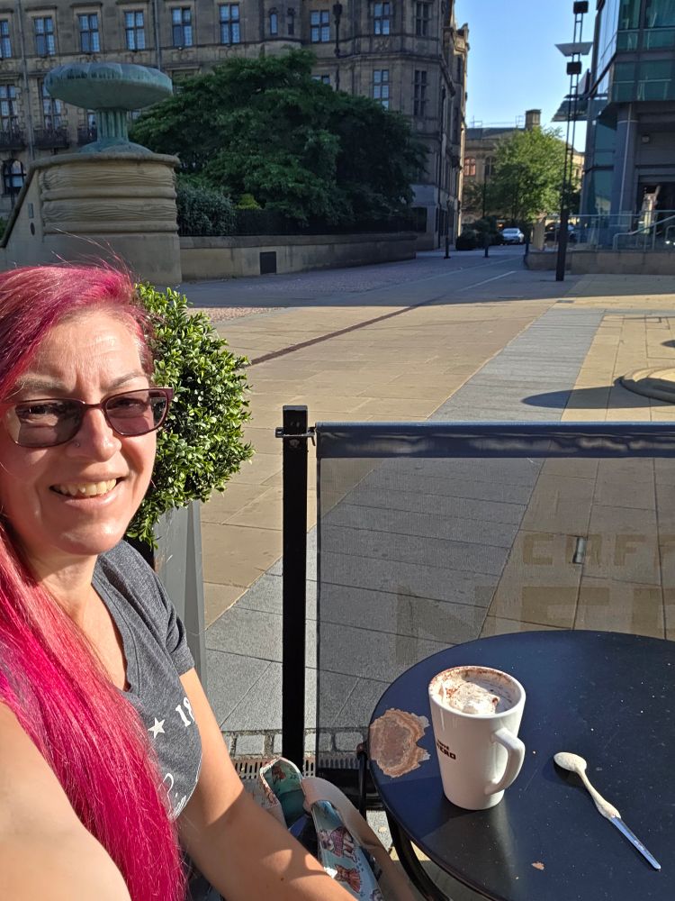 Me with a coffee outside cafe Nero in the sun