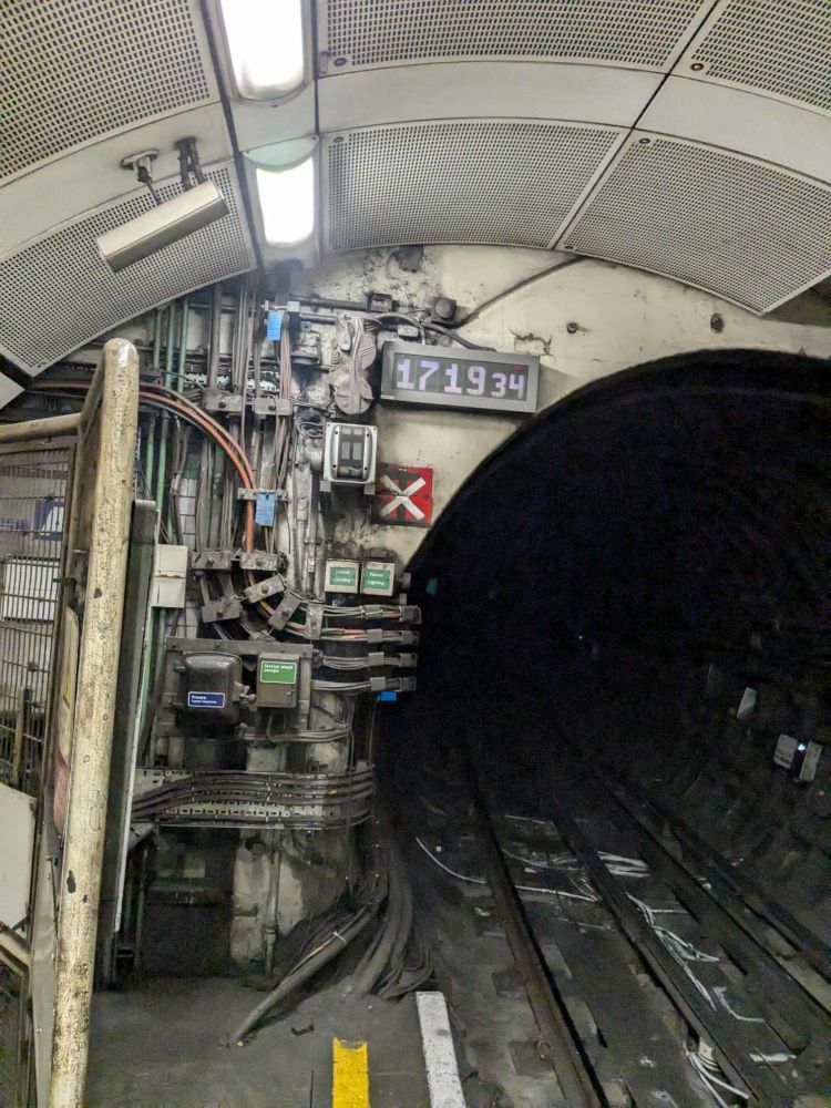 Wall clutter inside a London Underground station (Elephant & Castle I think?)