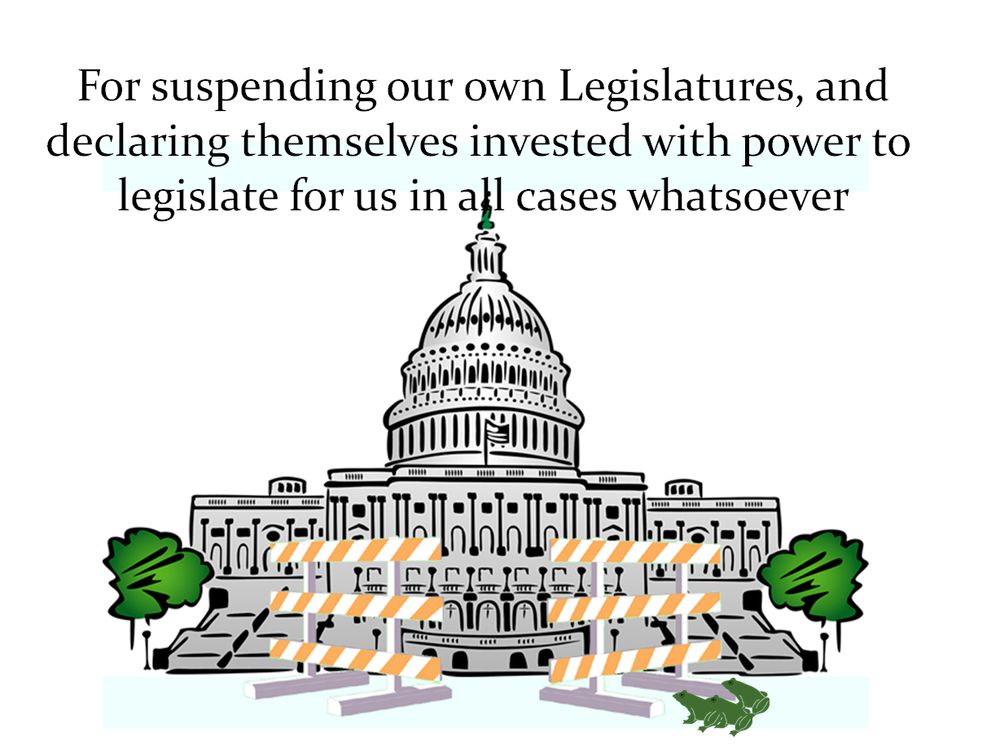 The US Capitol building, blocked by barricades, with frogs outside