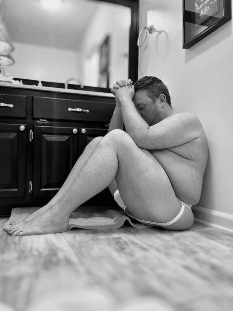 Tyler is sitting in the floor of the bathroom wearing only a jockstrap, hoping that the guys post pole for Monday 