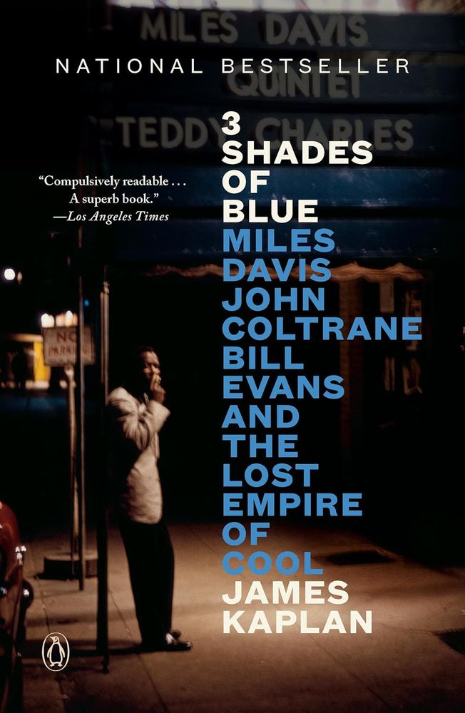 Cover of the book "Three Shades of Blue: Miles Davis, John Coltrane, Bill Evans and the lost empire of cool" by James Kaplan with a cool nightime picture of a dressed-to-the-nines Miles Davis smoking under a streetlight.