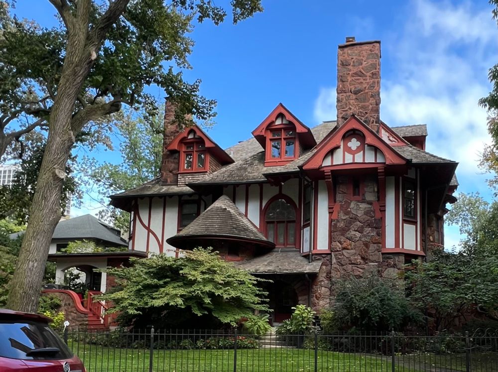 According to the AIA Guide to Chicago, "This is the earliest house in the Hutchinson Street district, designed for the street's developer, John C. Scales, in the Queen Anne style of Maher's early career.
Complex roof forms, beautifully reshingled, and high chimneys top heavily textured walls of boulders and half-timbering.