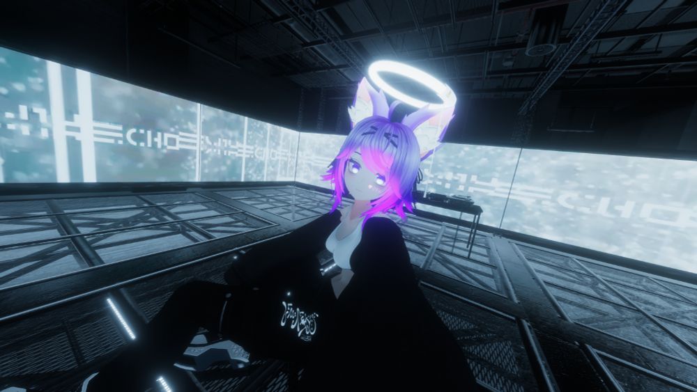 selfie of my vrchat avatar in a club venue, illuminated by screens all around the room. i am wearing cargo ish looking pants, a simple sports bra and a cropped jacket. i also have a glowing fluorescent light halo