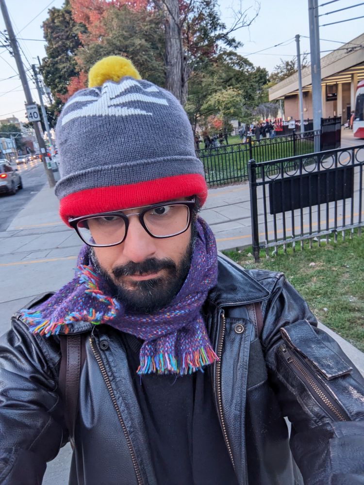 Man in Bobble hat with British Rail logo on it, looking FLY!