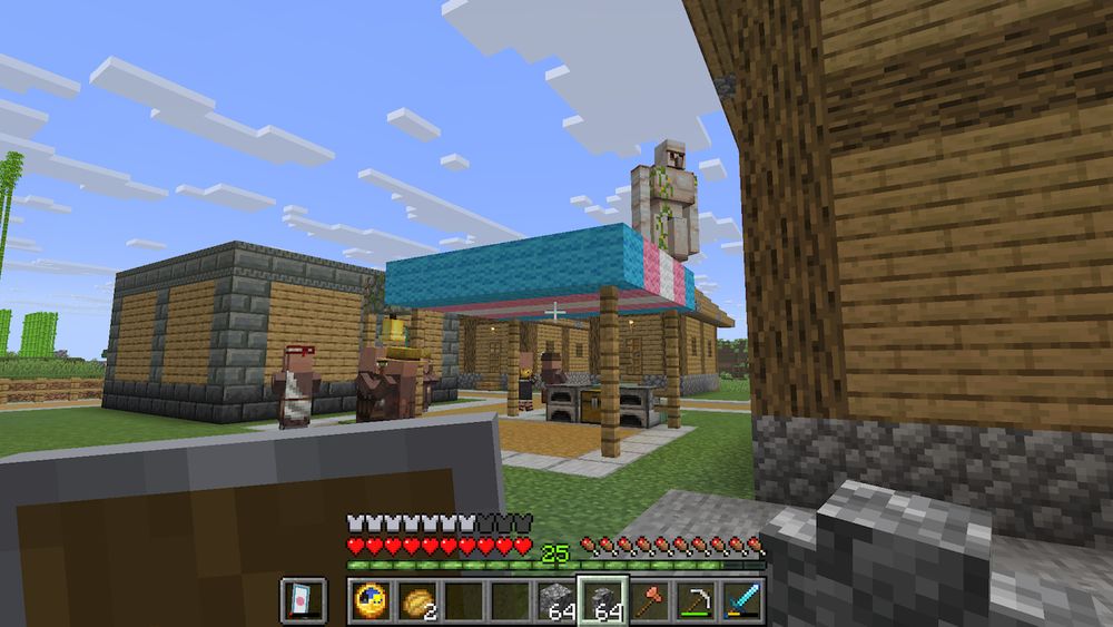 Minecraft screenshot
The focal point is an iron golem standing ON TOP of an awning that covers a villager meeting point in my self-built village. The awning is styled like the trans pride flag.
Unrelated to the surprise of it getting up there, to the left of the awning is a group of villagers hanging out. Buildings can be seen around the square.
How did the golem even get up there?