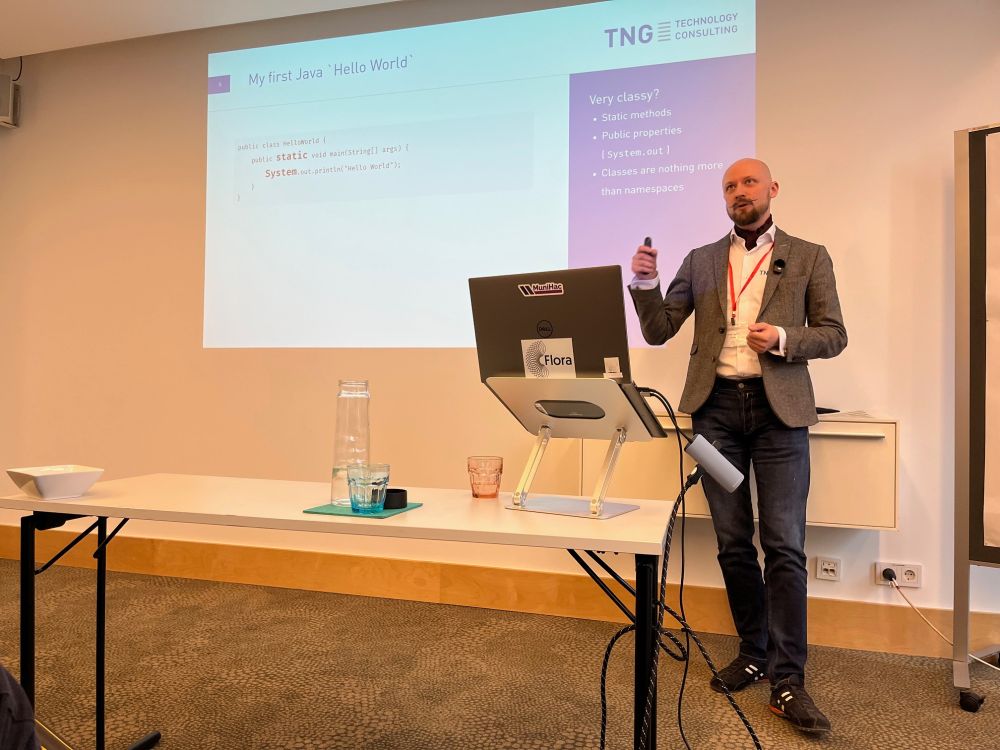 A person gives a talk at a conference.