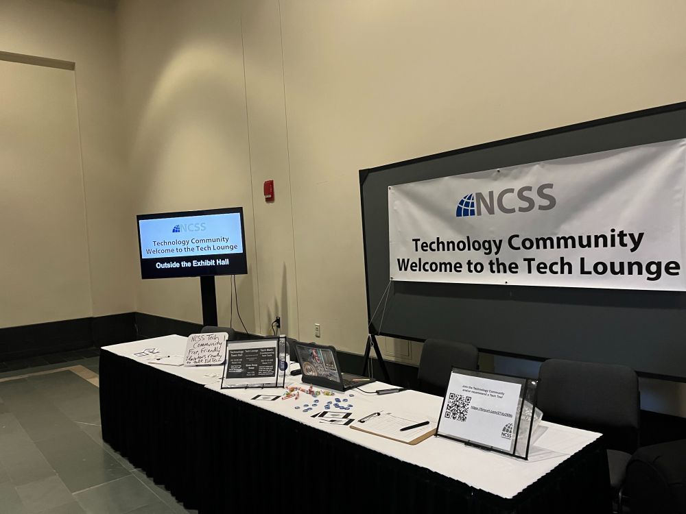 A booth with a sign reading Welcome to the Technology Community tech Lounge