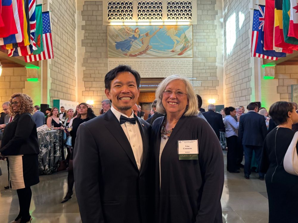 Two people smile as they pose for a photo at the 2025 National Academy of Medicine Induction ceremony in Washington, D.C.