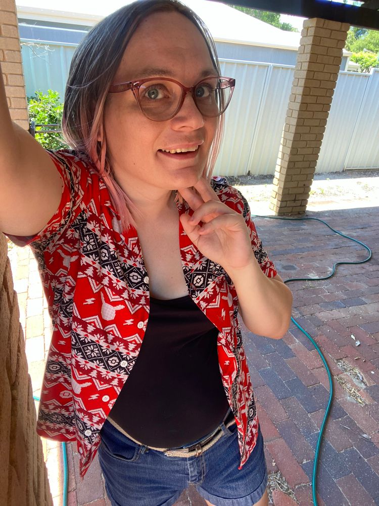 Me wearing a Hawaiian style Pokemon shirt patterned like an ugly Christmas sweater