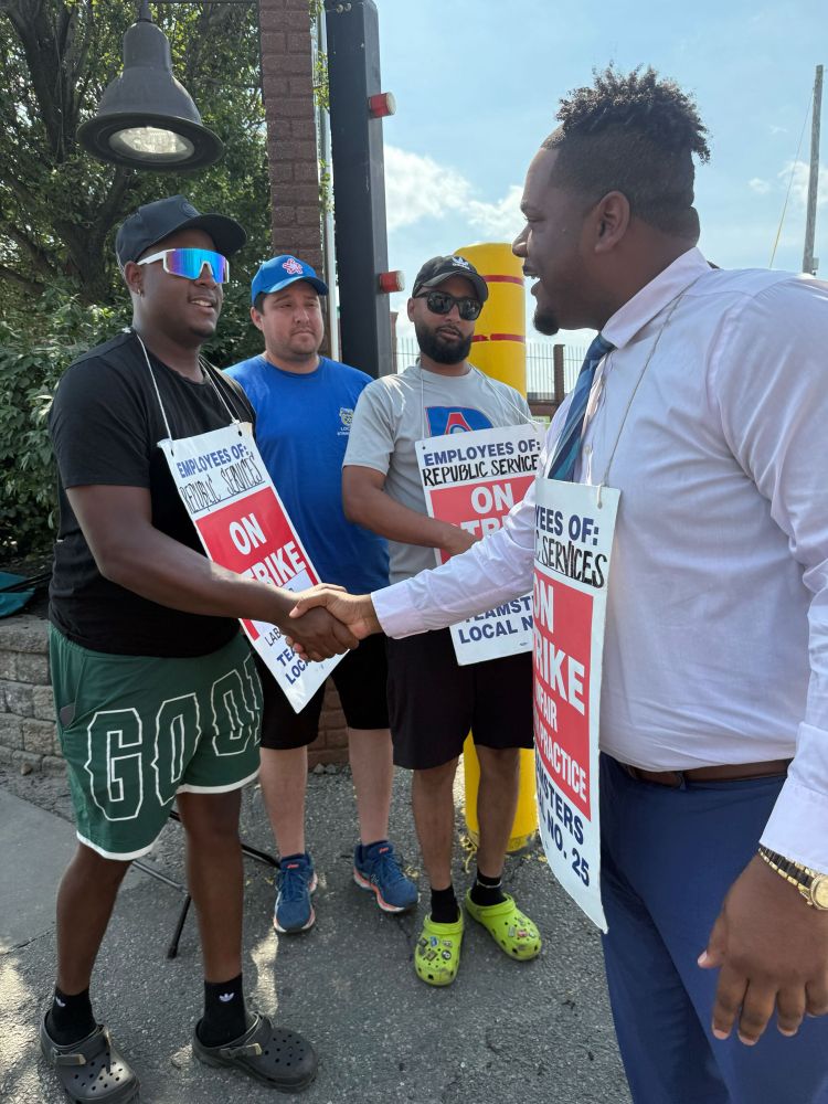 Councilor Santana shaking hands with a member of Teamsters Local 25 outside Republic Services