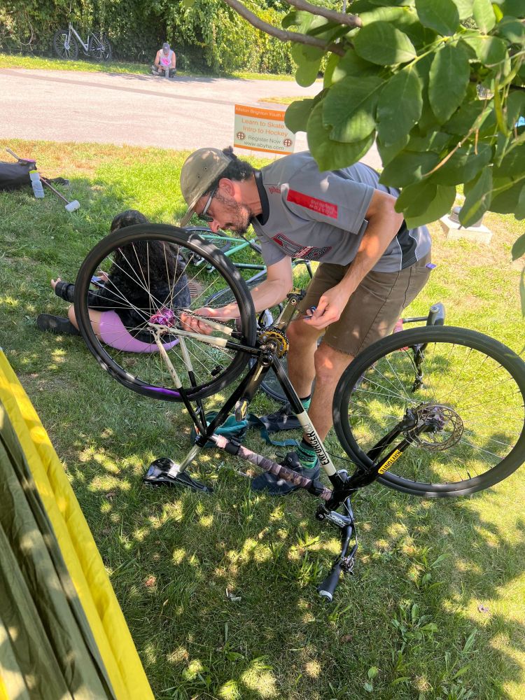 A bike under repair under a tree during the tourney