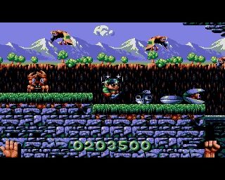 Screenshot of Magic Pockets by Bitmap Brothers. A childlike sprite surrounded by stars shirts in a blue and green angular platforming world with crabs, birds and giant clams around it.