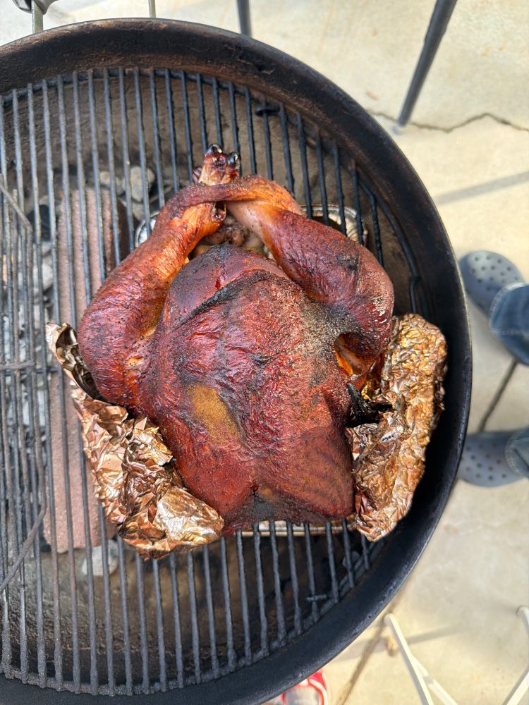 Turkey grilled to perfection on a Weber kettle grill for Thanksgiving 