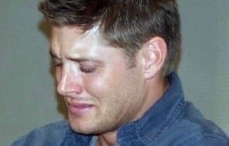 Guy crying halfway turned away.