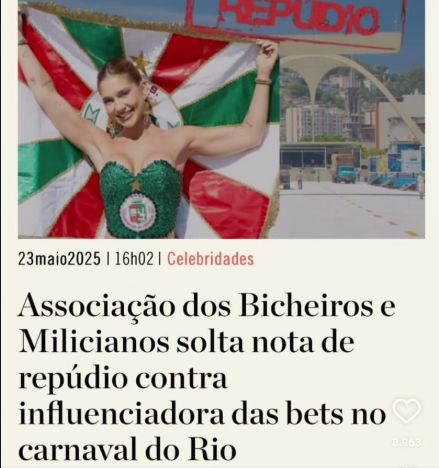 titulo de uma materia “Associação dos Bicheiros e Milicianos solta nota de repúdio contra
influenciadora das bets no carnaval do Rio” 

acima do titulo tem a Virginia usando um top verde com o escudo da grande rio no meio, ela esta com o cabelo preso divido no meio e segura a bandeira da grande rio levantada atras dela 