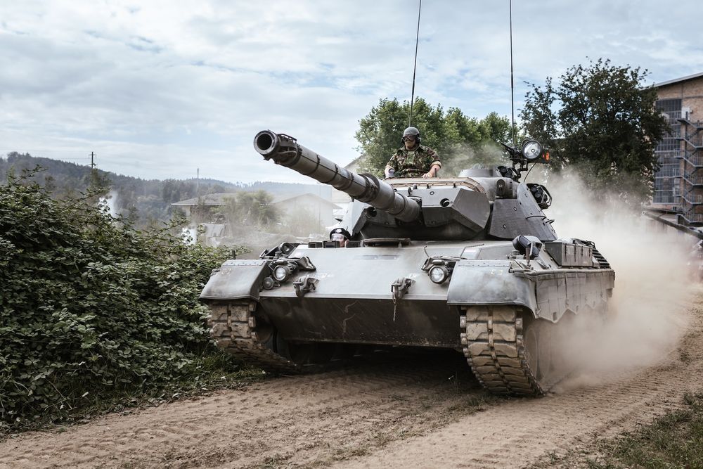 A tank on an unpaved road