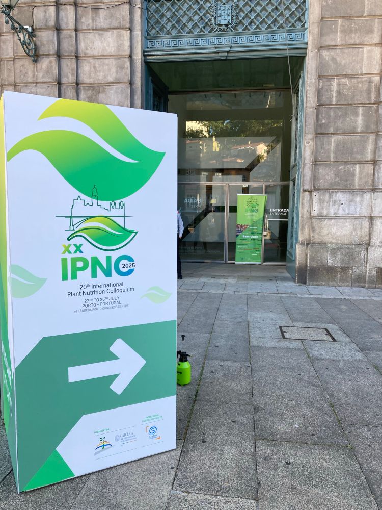 Entrance to a convention centre with a sign for international plant nutrition conference outside. 