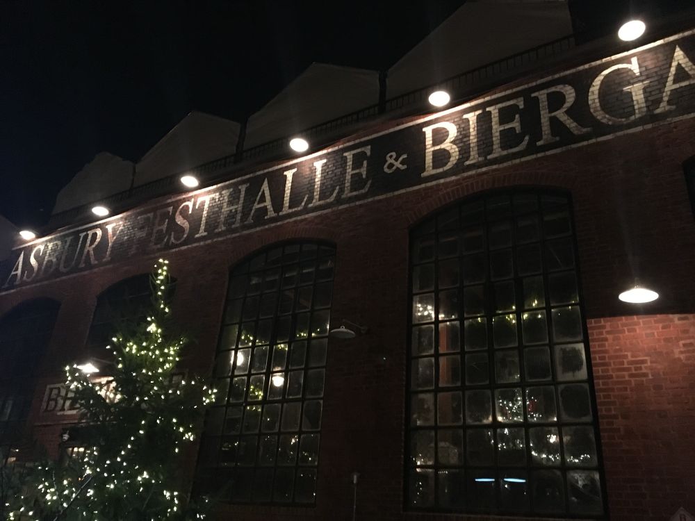 The Festhalle decorated for Christmas, exterior of a large brick building 