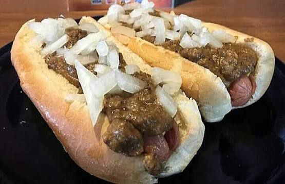 Scum dogs, Texas hots. 

Griddled hot dogs with mustard, covered with a Greek meat sauce and onion