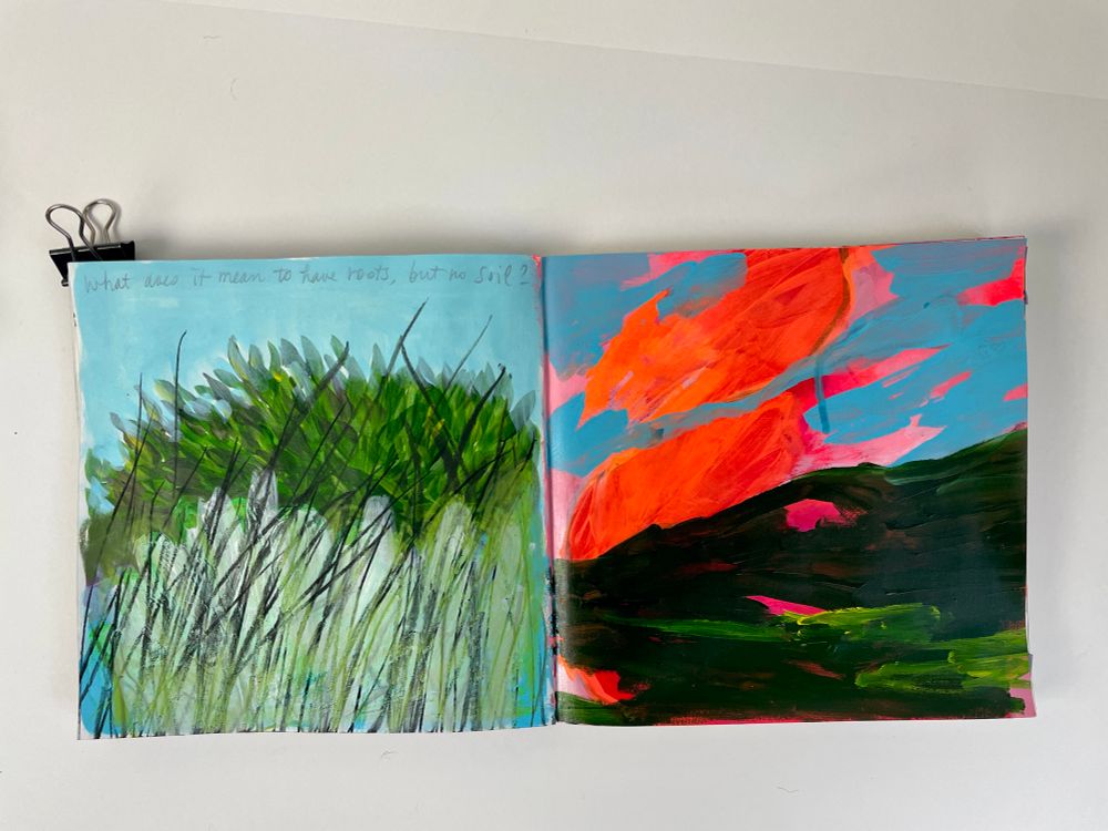 Sketchbook open in a spread on neutral background. Two imaginary scapes. On the left hand green bushes and grass in black charcoal. On the right hand an abstract landscape with orange neon and blue sky and dark heavy green mountains 