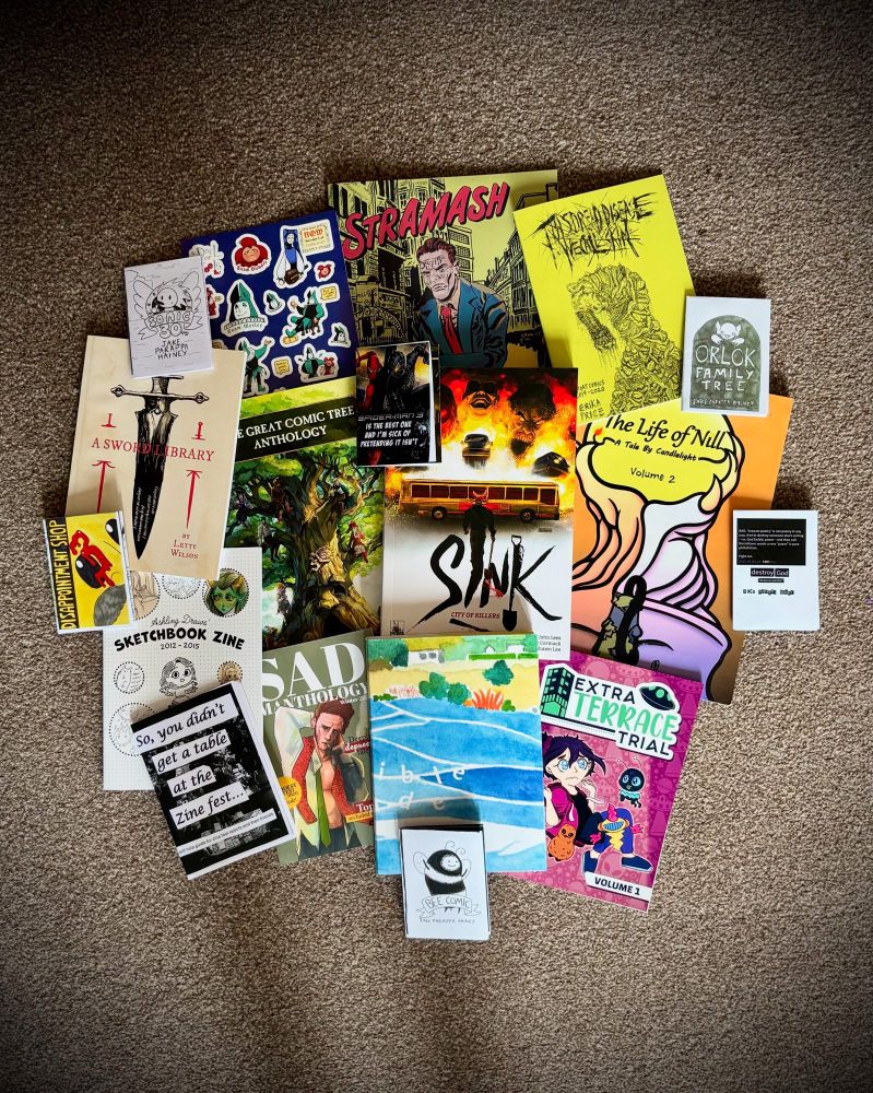 Photo of comics bought from Sequential Scotland 2025.