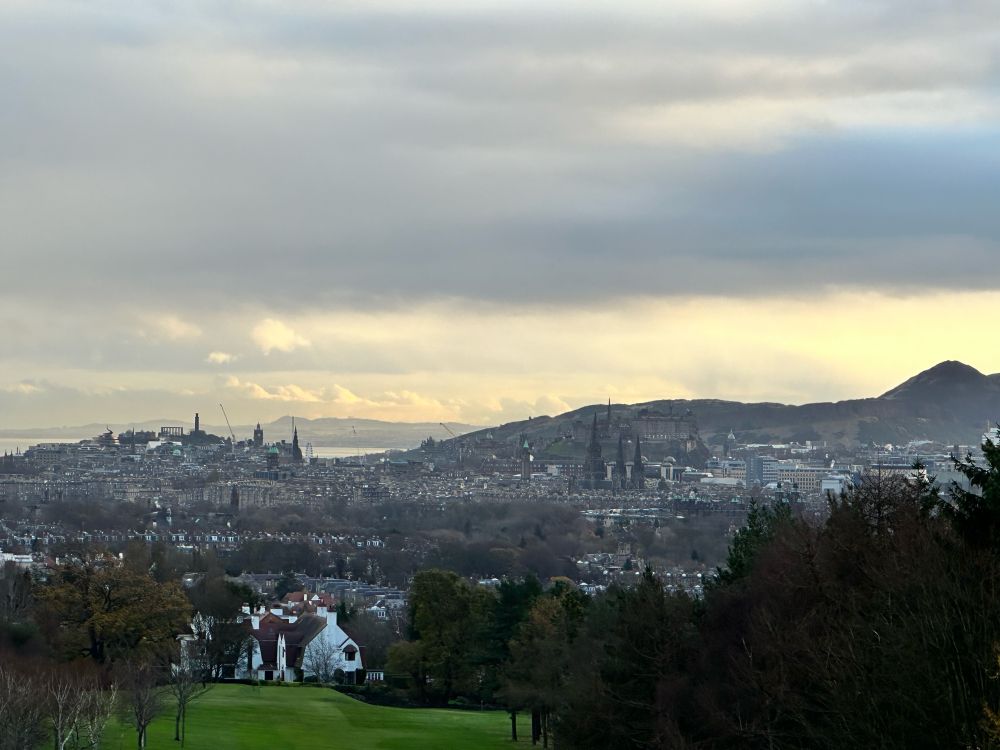 A view over Edinburgh and Arthur’s Seat with morning skies 