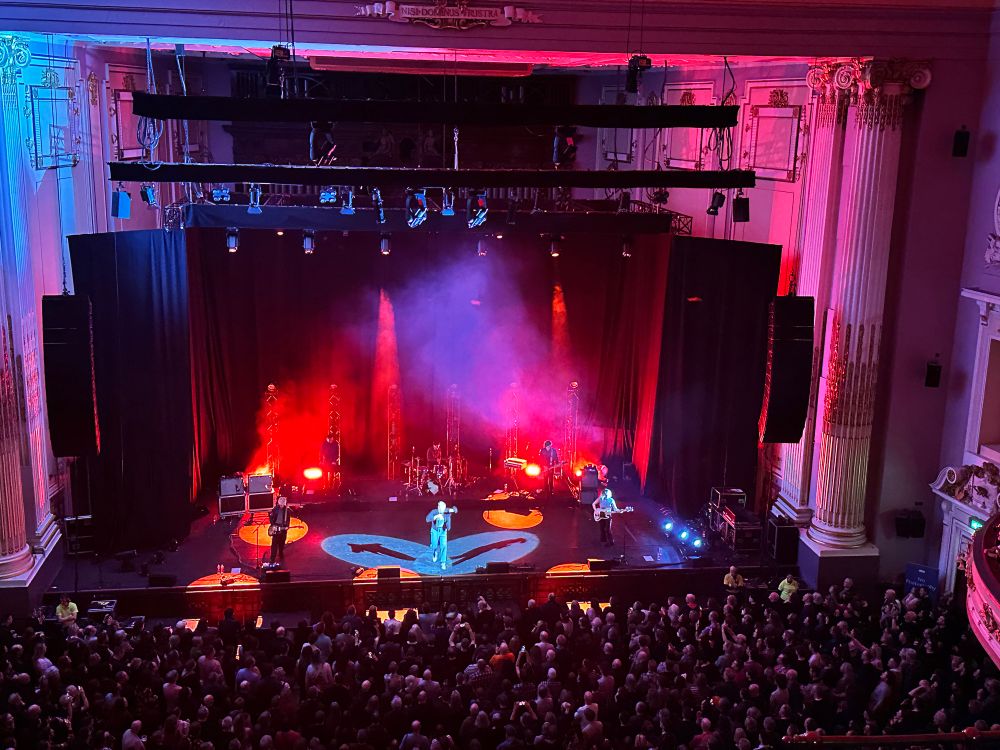 Hamish Hawk at the Usher Hall bathed in red lights 