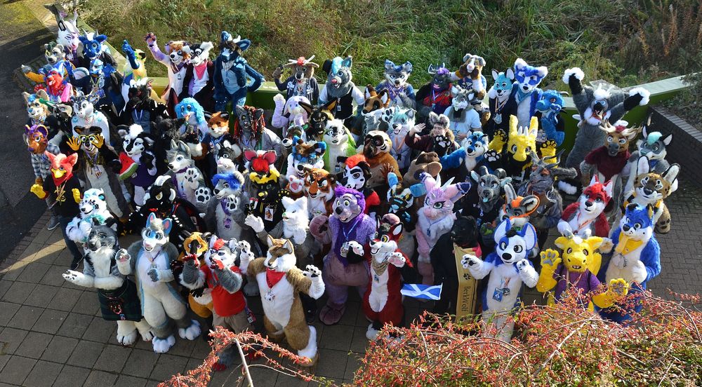 A very large gathering of fursuiters, as photographed from high above.