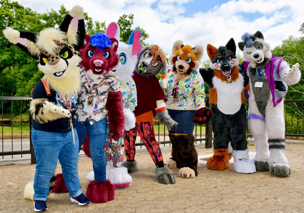 Several fursuiters posing for a group photo.