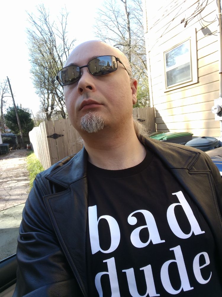 Some fucking egg wearing a "bad dude" t-shirt back in twenty aught seventeen, thinking he's cool in a leather trenchcoat and mirrorshades. Seriously, you ain't fooling anyone