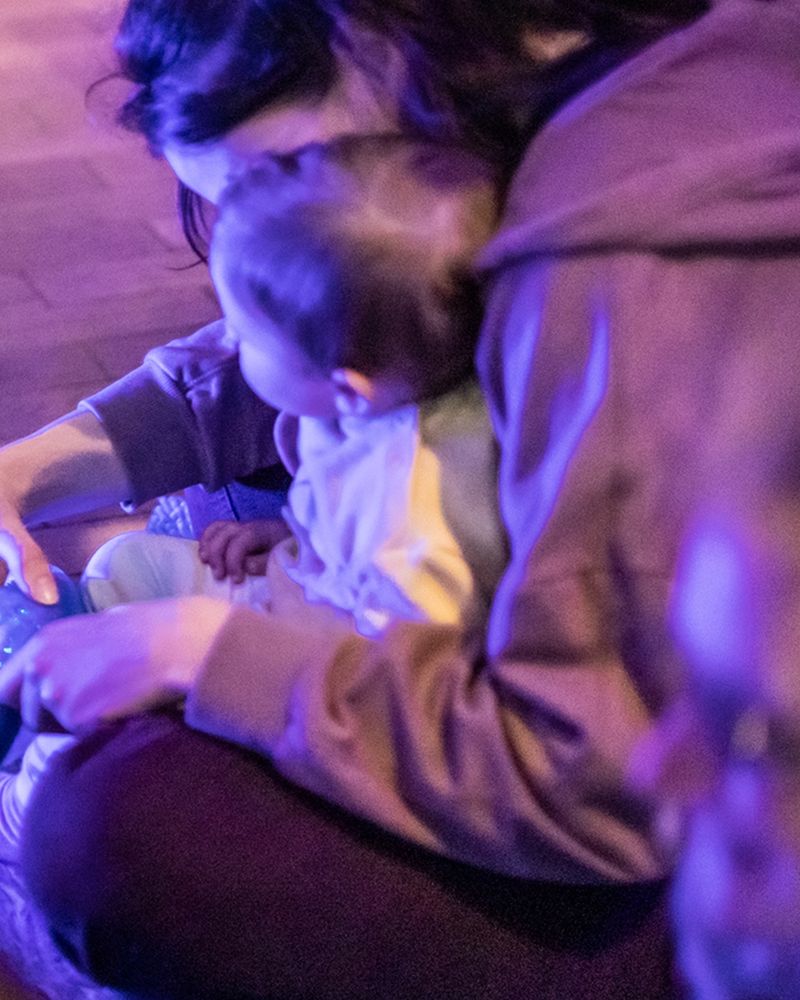 A parent cuddling a child 