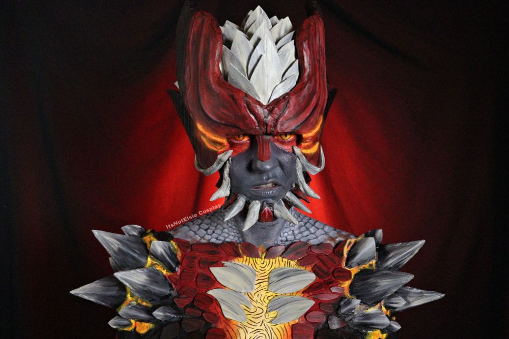 Itsnotelsie as Devil Trigger Dante from Devil May Cry 5. Foam was used to create the horns, spikes, and scales, a mesh shirt was painted to look like his torso, and body paint was used to connect everything on the fave, neck, and shoulders