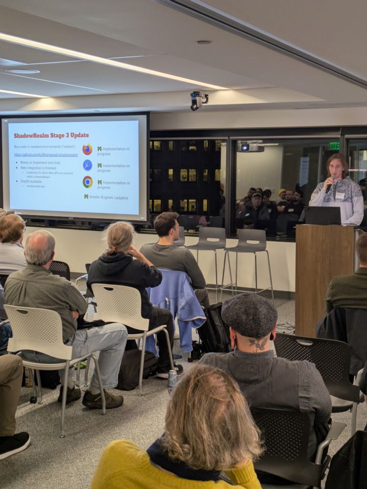 A speaker presenting slides about ShadowRealm