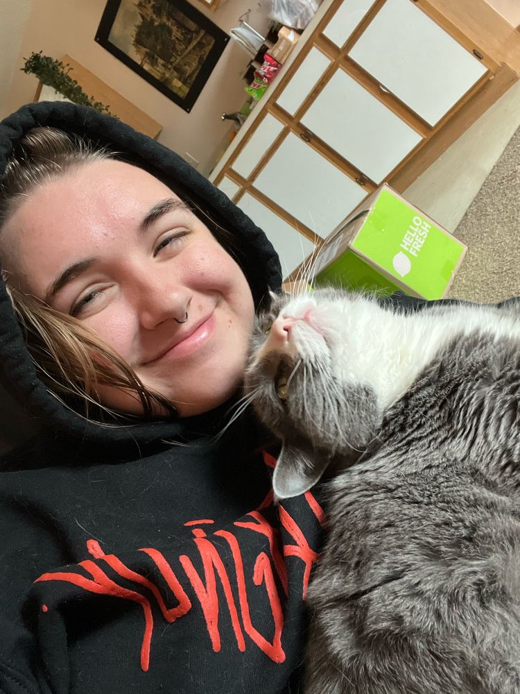 Me and a gray cat sitting together.